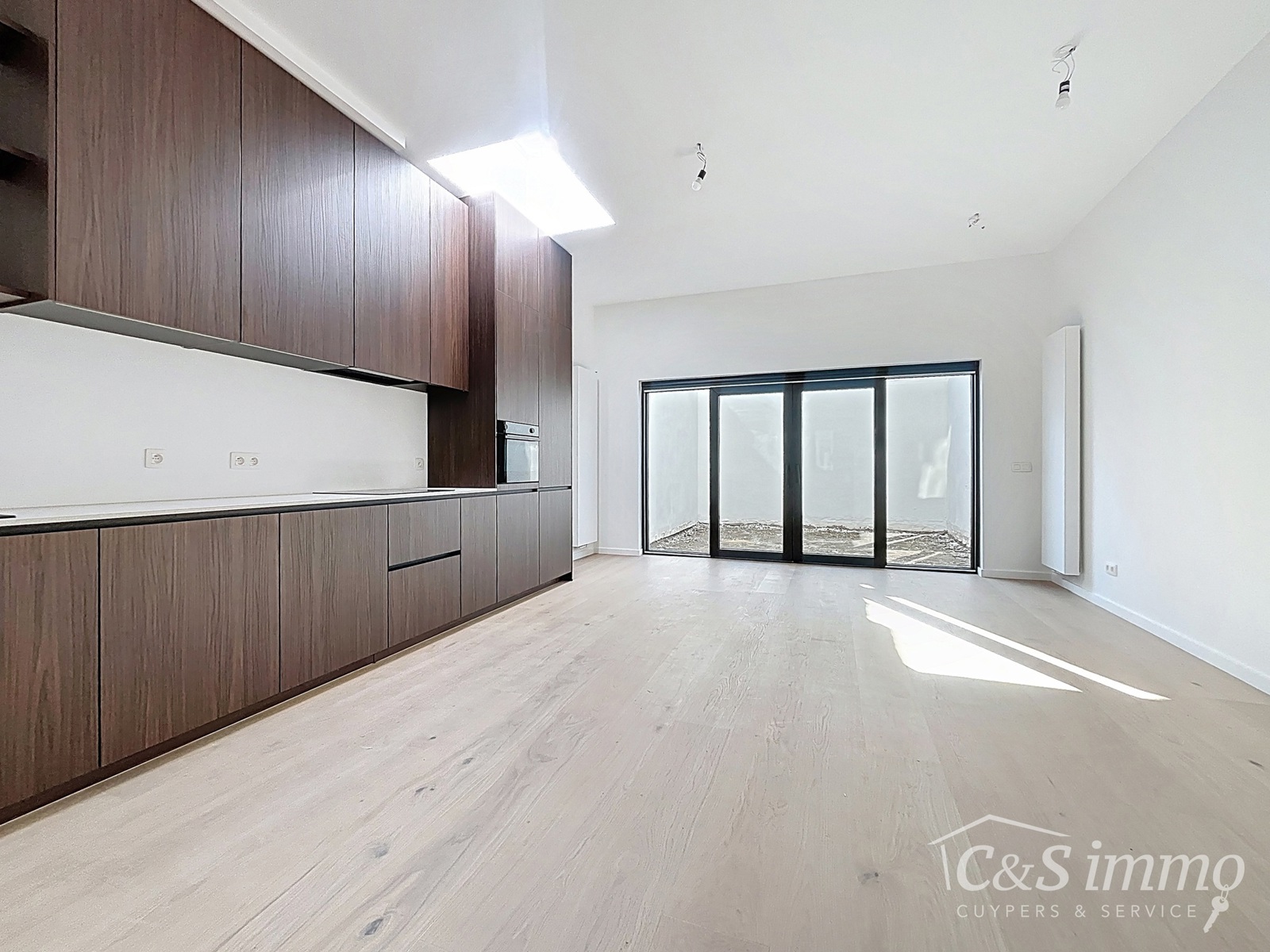 Gerenoveerd gelijkvloers appartement met stadstuin - foto 1