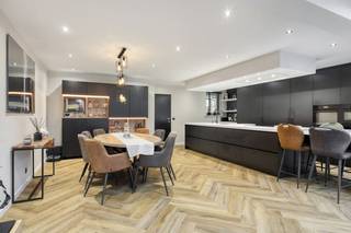 The house that we offer for sale in Stabroek is centrally located on the Grote Molenweg near all important facilities such as schools/shops, but with plenty of parking in front of the door - this makes it all ideal for families with children!Upon entering the house, you are welcomed by a spacious entrance hall, which leads to the living room. The bright living room has a dining and sitting area and is directly connected to the fully equipped open kitchen, all provided in the completely renovated extension. Through the living space, you have access to the beautifully landscaped garden, where you can enjoy peace and quiet and a built-in swimming pool. Furthermore, on the ground floor, there is a spacious garage with storage space, equipped with connections for washing machine and dryer, and a separate guest toilet. A separate passage to the garden is also provided. On the first floor, there are three large bedrooms and a bathroom. The second floor was fully finished and includes a fourth bedroom with built-in wardrobes. Last but not least, the garden with lots of privacy and a built-in swimming pool. The ideal setting for cosy summer nights! Details: - favorable EPC:... - indoor garage - very convenient location in Stabroek Interested? Contact our real estate office quickly! 03/666 66 66 or femke.van.helvert@dewaele.com - your Dewaele office in Kapellen at Hoevensebaan 25 - always free estimation and sales advice!EPC: 145 kWh/m²EPC: