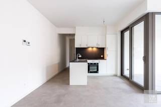 LAYOUT:Apartment 1.01 is located on the first floor and has an entrance hall with cloakroom and guest toilet, living room, open kitchen and a covered...