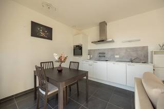Modern 1-slaapkamerappartement met terrasGelegen op een toplocatie nabij winkels en voorzieningen aan de Plantin en Moretuslei, met vlotte...