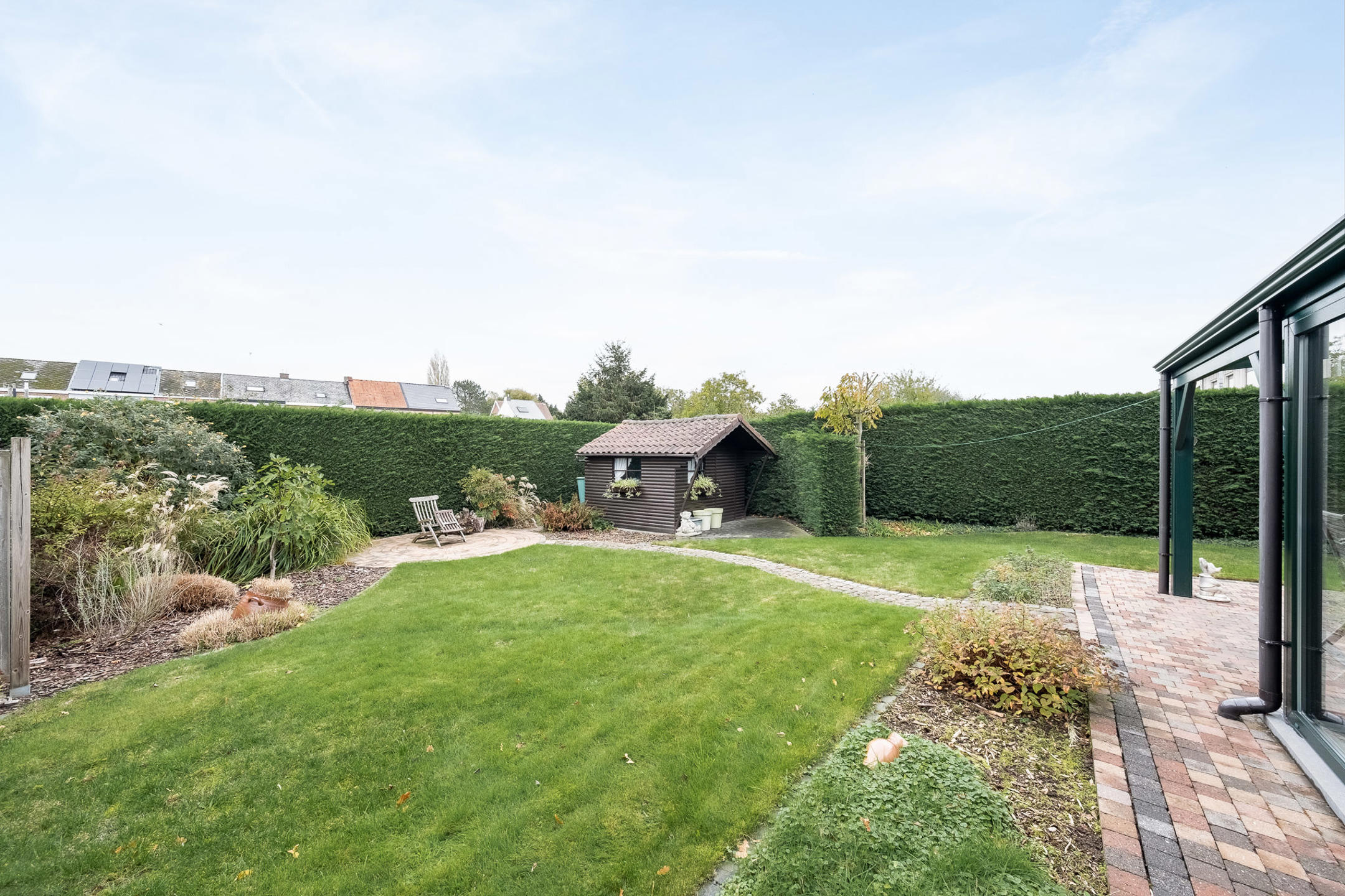 Halfopen bebouwing met aangename tuin en garage - foto 4