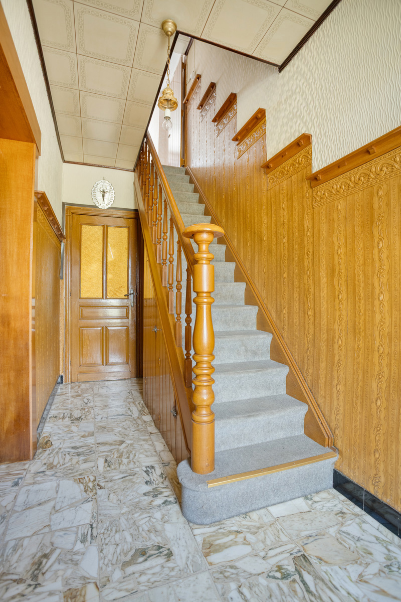 Karaktervolle open bebouwing met zonnige tuin en renovatiepotentieel - foto 4