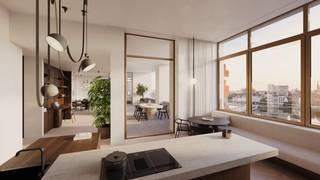 <p>Nestled between the lively waters of the Scheldt and the Bonaparte Dock, a place once known for bananas and trade is making way for an elegant new future defined by balance and beauty.</p>
<p>The site’s fruity past lives on in Friendship Residence, a subtle tribute to its history. The future here is bright and full of potential. This is where the vibrant rhythm of the city merges seamlessly with the calm of the water.</p>
<p>In the fusion of luxury and artistic boldness, Friendship Residence finds its perfect emblem.</p>
<p>Friendship Residence was designed through a collaboration between the Antwerp-based studio HUB Architecten and the London practice DRDH Architects. The result is a unique interplay of local sensibility and international perspective.</p>
<p>Their vision takes shape as a contemporary ode to the historic warehouse architecture of Het Eilandje. Here, there is no fragmentation, only visual harmony. A carefully composed ensemble in which each building has its own identity and atmosphere. A place designed not only for living, but above all for experiencing.</p>
<p>From the outside, Friendship Residence immediately makes a striking impression. High-quality façades with green accents, refined detailing and expansive windows create an aesthetic enrichment for the neighbourhood. Mineral materials were consciously selected to honour the character of the location, ranging from the iconic warehouse style to urban buildings with brick accents.</p>
<p>That sense of quality is felt down to the smallest detail upon arrival. Through the luxurious entrance halls, residents enter the buildings in a stylish transition from the city to their personal haven.</p>
<p>The spacious inner garden was designed by renowned landscape architect Erik Dhont. With internationally acclaimed projects and as laureate of the prestigious competition for the new palace gardens in Brussels, the studio guarantees a landscape design of royal calibre.</p>
<p>The unmistakable charm of this hidden oasis invites residents to slow down and savour the moment. A lush interplay of flowers, shrubs and trees creates a sheltered retreat that briefly makes the pace of the city disappear. Natural stone pathways guide you along a reflective water feature radiating serenity, with inviting resting spots that encourage you to enjoy both sun and shade.</p>