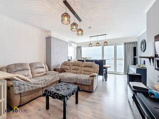 Dit charmant appartement bevindt zich op de 1ste verdieping (lift aanwezig) en beschikt over een inkom met vestiaire, een gezellige...