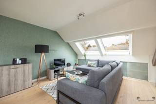 <p><span>Modern, stylish rooftop apartment with spacious terrace and panoramic views</span></p><p><span>Discover this stylish rooftop apartment on the second floor, where comfort meets modern living pleasure. The spacious sun terrace offers stunning, unobstructed views ideal for relaxing or hosting friends.</span></p><p><span>Inside you will enjoy a light-filled living space with warm wooden floors, Velux windows fitted with blinds and timeless finishes. The house features two bedrooms (12 m² and 11 m² with mezzanine), perfect for a family, a home office or guest room. The bathroom is equipped with a bathtub for extra comfort there is a separate toilet.</span></p><p><span>A modern heat pump with air conditioning ensures a pleasant indoor climate all year round. Velux blinds also provide optimal light management and additional living comfort. The apartment is extremely well maintained and ready to move into.</span></p><p><span>Parking space included.</span></p><p><span> </span></p><p><span>Are you interested in this beautiful apartment? Contact us soon for a visit!</span></p>