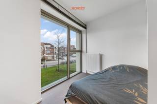 Deze ruime en bemeubelde studentenkamer met eigen sanitair maakt deel uit van residentie WOODS, een architecturale eyecatcher vlakbij het...