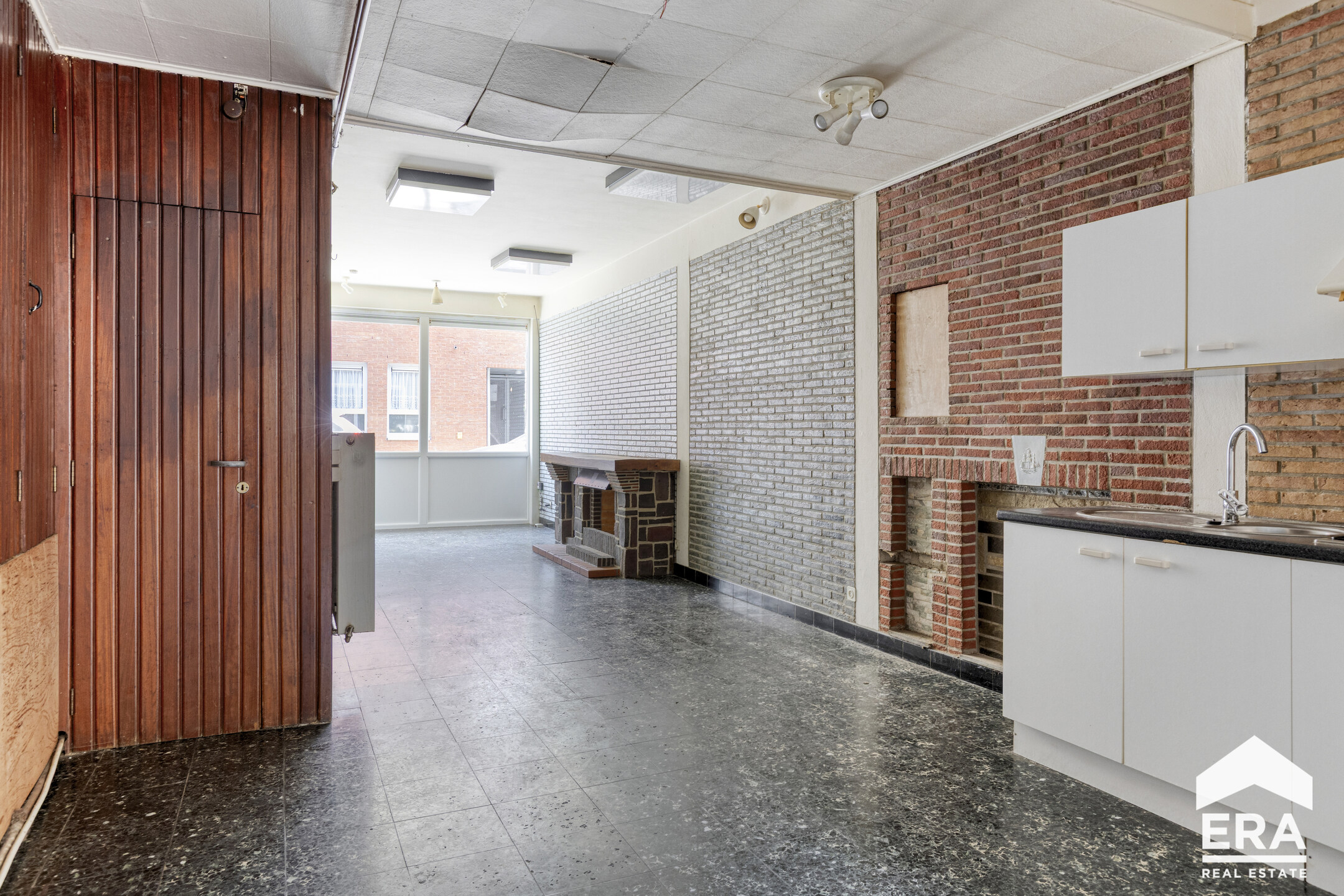 Gelijkvloerse winkel met terras in centrum Tienen - foto 1