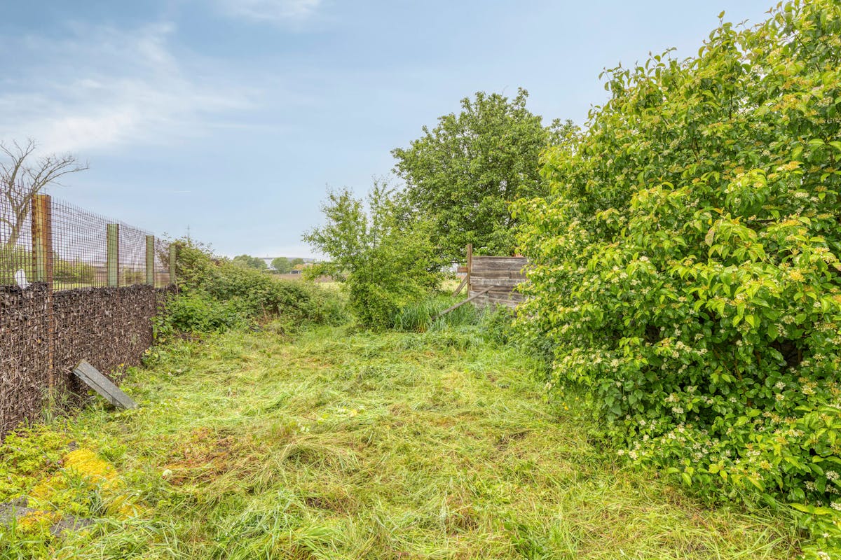 Te renoveren woning met grote tuin en bijgebouw te Heule - foto 5