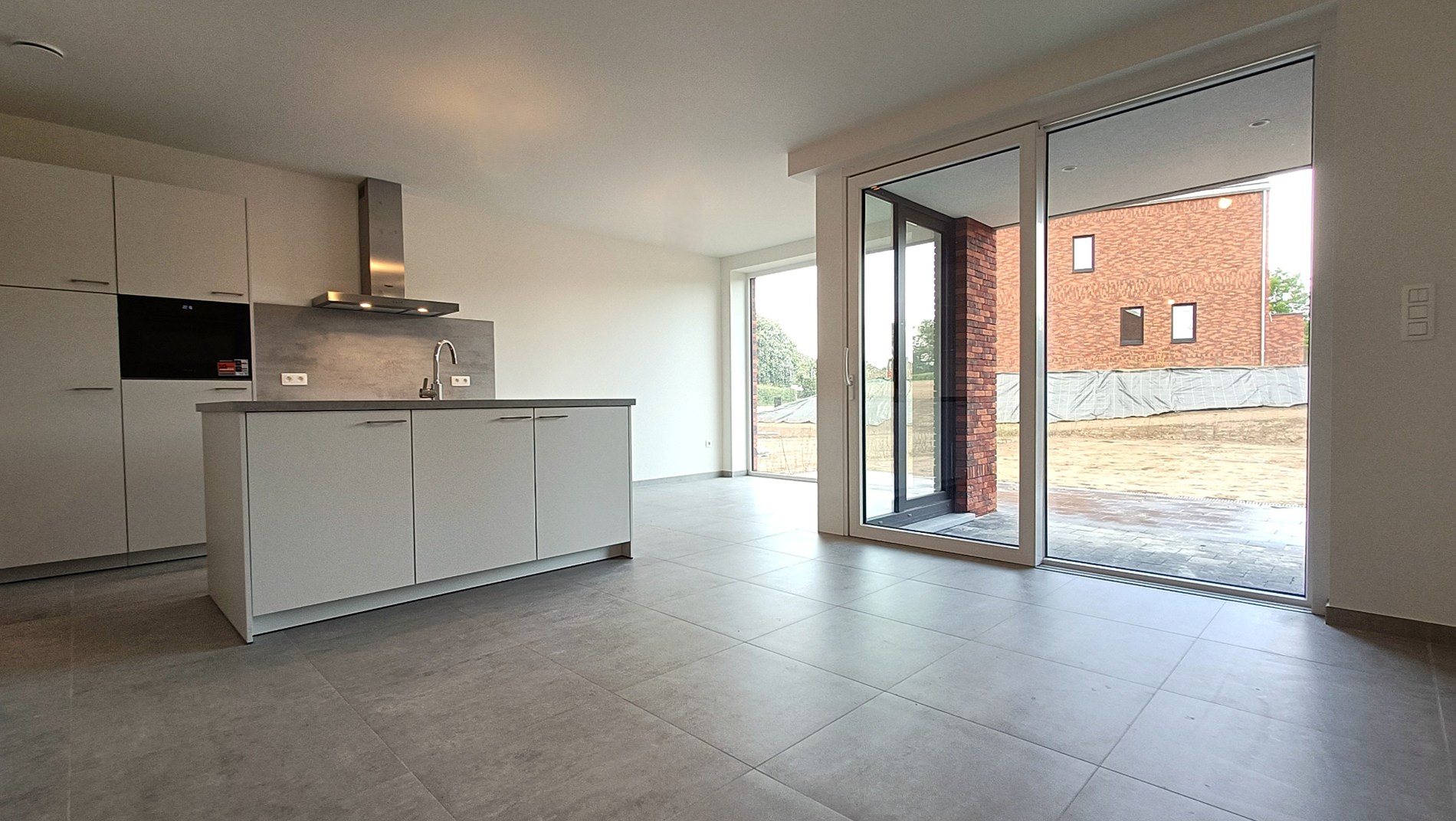 Nieuwbouwappartement met tuin en terras - foto 4