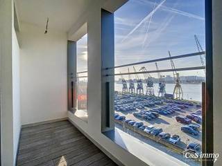 Hedendaags volledig gerenoveerd appartement (ca 75m²) met frontaal uitzicht op de Schelde in een monumentaal gebouw op het Eilandje. Woon- en...