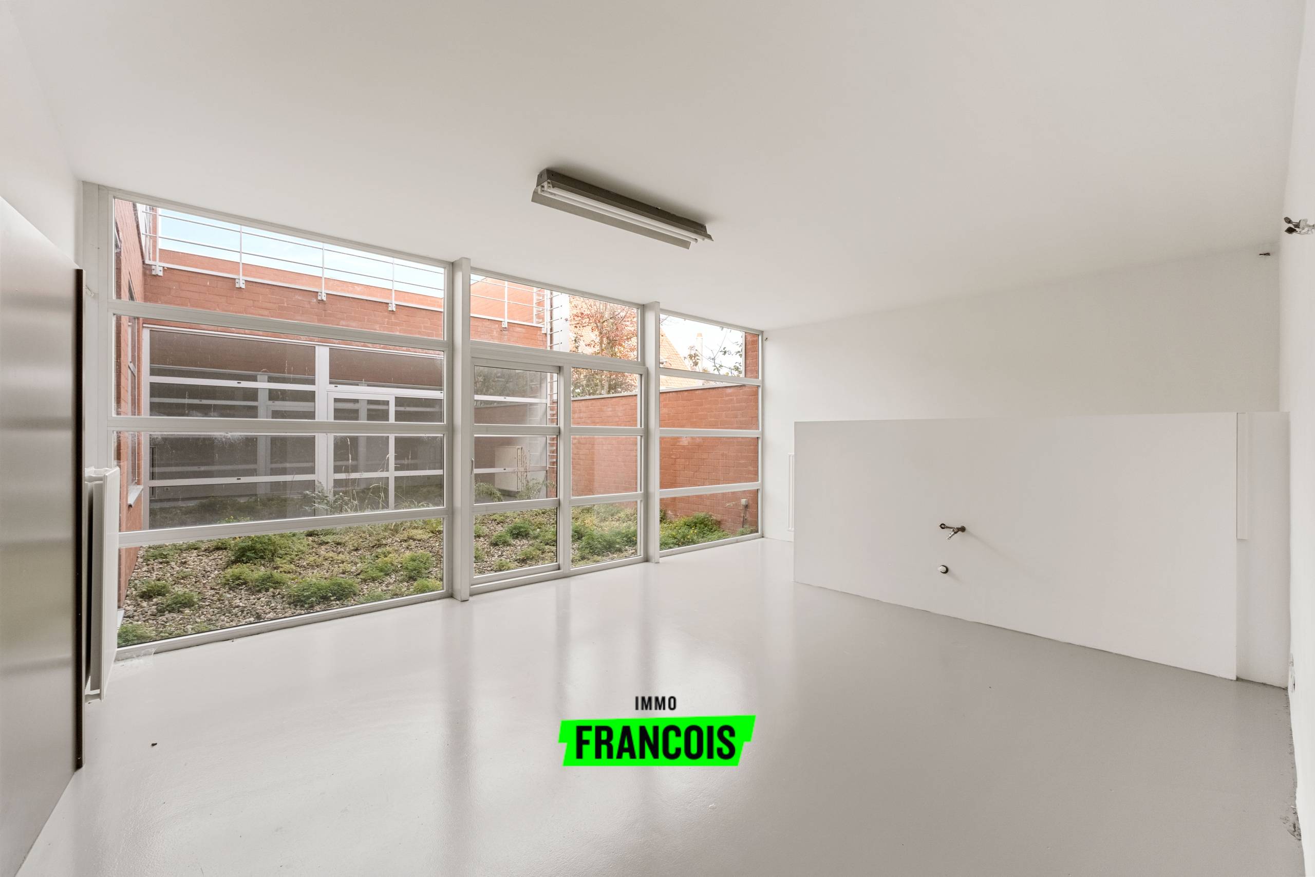 Exclusieve loft op het gelijkvloers met binnentuin gelegen te Sint-Andries - foto 4