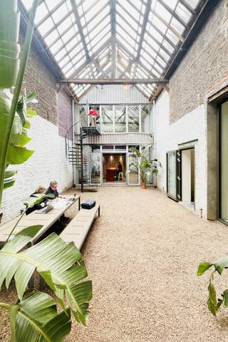 Co-working spaces for rent in Van Meyel Street in Sint-Jans-Molenbeek, located in a vibrant co-living environment shared with other businesses...