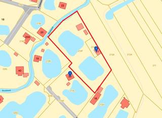 Grote recreatiegrond (niet geschikt voor het bouwen van recreatiewoning) in een groene omgeving te Wechelderzande (Lille). De grond is rustig en achterliggend gelegen en beschikt over twee grote vijvers.