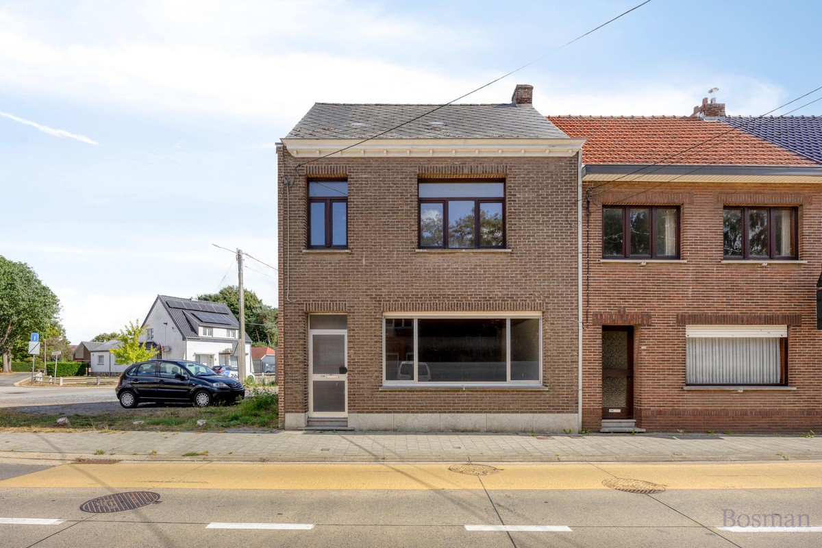 Halfopen bebouwing met 5 garageboxen te koop in Ham - foto 1