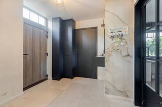 <h1><span>Spacious and energy-efficient 5-bedroom home with an E-level of -6</span></h1><p><span>Modern architecture, exceptionally energy-efficient (passive house) and surprisingly spacious! This stylish home, built in 2023, offers everything you’re looking for in contemporary family living.</span></p><p><span>This beautiful home immediately stands out for its </span><span>timeless architectural style</span><span>, combining characterful facing brick with sleek black window frames and a contemporary roofline. The architecture exudes tranquility and elegance while creating a warm, homey atmosphere. The well-maintained front yard and spacious driveway enhance the home’s modern character.</span></p><p><span>This stylish aesthetic continues inside. The home features a </span><span>spacious and light-filled living area</span><span> that flows seamlessly into the modern kitchen with a generous </span><span>kitchen island</span><span>. Thanks to the open layout, a particularly pleasant living environment is created where cooking, dining, and relaxing come together beautifully.</span></p><p><span>A major asset is the </span><span>multifunctional room on the ground floor</span><span>. It is currently set up as </span><span>an office</span><span>, but thanks to its practical layout, it can easily be converted into a </span><span>sixth bedroom</span><span>. This gives the home exceptional flexibility, making it ideal for larger families or anyone who needs an extra space for work, hobbies, or sleeping.</span></p><p><span>The upper floors feature </span><span>five full-sized bedrooms</span><span>, complemented by exceptionally comfortable bathroom facilities. The home has </span><span>two shower rooms (on the ground floor and second floor) and a spacious bathroom (on the first floor)</span><span>, ensuring ample comfort and privacy for the entire family.</span></p><h3><span>Outstanding Energy Performance</span></h3><p><span>Technically, this home also clearly stands out from traditional homes. With an </span><span>E-level of -6</span>,<span> it is exceptionally energy-efficient and fully geared toward the future.</span></p><p><span>The home is equipped with:</span></p><ul><li><span>Electric heat pump</span></li><li><span>Underfloor heating</span></li><li><span>Solar panels</span></li><li><span>Charging station for an electric car</span></li><li><span>Ventilation System D with heat recovery</span></li><li><span>Highly insulated building envelope</span></li></ul><p><span>The EPB report lists an </span><span>E-level of -6</span><span> and an annual primary energy consumption of </span><span>-11.80 kWh/m</span><span>². According to the EPB declaration, the solar panels have an estimated electricity production of </span><span>5,127 kWh per year</span><span>.</span></p><h3><span>A home with space for today and tomorrow</span></h3><p><span>With its </span><span>five bedrooms, multifunctional office/bedroom on the ground floor, spacious living area, modern kitchen, three bathrooms, and exceptional energy performance</span>,<span> this is a home that effortlessly grows with its residents.</span></p><p><span>The combination of </span><span>contemporary architecture, characterful facing brick, sleek window frames, generous spaces, and thorough energy efficiency</span><span> makes this a particularly attractive family home for those who refuse to compromise between style, comfort, and future-oriented living.</span></p><p><span>A stylish and energy-efficient new-build home that you absolutely must come and discover for yourself.</span></p><p><span>Want more information or to schedule a visit?</span><span>#NewLine #Contact us with no obligation at </span><span>011 199 991</span><span> or </span><span> lindseyswennen@janssenenjanssen.be.<br />Wij</span>—<span>we’d be happy to assist you and look forward to scheduling a visit to this beautiful home.</span></p>