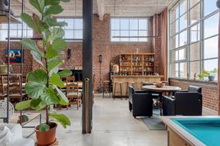 DISCOVERY DAY August 15 from 10 a.m. to 12 p.m. (By appointment only!)www.doorniksesteenweg151loft211.beThis extremely spacious loft, with a living area of no less than 267 m², features 5-meter-high windows that bathe the entire space in natural light. Finished with top-quality, sustainable materials such as a natural stone floor: DESERTSTONE, solid-core oak flooring, and a handcrafted wrought-iron balustrade. This is combined with authentic elements that have been reintegrated from the original spinning mill. The loft welcomes you with an impressive entry hall featuring tall built-in cabinets, leading to a very spacious living area with beautiful natural light and an open layout. A spacious seating area with a 4K home theater, a billiards room, a separate bar with a breakfast nook, a dining area for 12 people, and a fully equipped, open kitchen. From the living area, you have a view of and access to the 42 m² terrace through the large sliding window, where you can relax in complete peace and privacy. The bathroom welcomes you with a relaxing atmosphere. It’s equipped with a luxurious two-person whirlpool tub, dual open showers, a double sink, a toilet, an infrared sauna, and—as the icing on the cake—an authentic oak wine cellar that has been converted into a Finnish sauna. The ultimate bathroom designed for perfect relaxation. Adjacent to the kitchen is a handy utility room and a separate restroom with a sink and urinal. On the mezzanine level, accessible via the authentic staircase from the spinning mill, there are two bedrooms and an open office area. Finished with handcrafted wrought-iron balustrades and built-in oak wardrobes. Equipped with gas-fired underfloor heating, up-to-code electrical wiring, and sunshades/curtains on all windows, this loft is completely move-in ready! There is an option to purchase an underground garage for four cars, complete with a large workshop, for €66,000. This unique living environment at the GROOTTE FABRIEKE offers numerous amenities for its residents. These include several communal garden areas, a lounge area with petanque and barbecue facilities, and a museum café where private events can be held. Several projects are currently in the final stages of planning, such as a multipurpose hall and a green courtyard garden on the west side. Want more info or to schedule a visit? Contact Stein at 0468 41 38 48 or stein@immovercoutere.be