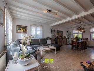 <span><strong>KARAKTERVOLLE VRIJSTAANDE WONING MET 4 SLAAPKAMERS OP EEN MOOI HOEKPERCEEL VAN 5A30CA TE MAASEIK<br /><br />TROEVEN<br /></strong>- Gelegen dichtbij het gezellige centrum van Maaseik.<br />- Rustige en kindvriendelijke woonomgeving. <br />- Zeer goed onderhouden woning.<br />- Ruime woning met een bewoonbare oppervlakte van 195 m². <br />- EPC-D: Geen renovatieverplichting.<br />- Doucheruimte op het gelijkvloers! <br />- Volledig onderkelderd. <br />- Beklinkerde oprit naar de inpandige garage.<br />- Aangelegde en omheinde tuin. <strong><br /></strong><strong><br />KELDERVERDIEPING -01<br /></strong>- Traphal (5,60 x 2,30m = 12,88m²): trap naar het gelijkvloers, tegelvloer. <strong><br /></strong>- Kelderruimte 1 (4,50 x 7,15m = 32,18m²): betonvloer. <br />- Kelderruimte 2 (4,20 x 5,60m = 23,52m²): betonvloer. <br />- Kelderruimte 3 (4,00 x 5,20m = 20,80m²): betonvloer. <br />- Kelderruimte 4 (2,60 x 3,60m = 9,36m²): Cv-ruimte, betonvloer. <strong><br /><br />GELIJKVLOERS 00<br /></strong>- Inkomhal (1,80m x 5,60m = 10,08m²): tegelvloer. <br />- Traphal (1,00m x 1,00m = 1,00 m²): trap naar verdieping 1, tegelvloer.<br />- Hal (1,00m x 5,40m = 5,40 m²): trap naar de kelder, tegelvloer.<br />- Woonkamer (4,50m x 7,10m = 31,95m²): houthaard met TV-wand, laminaat. </span><br /><span>- Keuken (4,30m x 4,40m = 18,92m²): geïnstalleerde keuken met onderkasten, bovenkasten, dubbele spoelbak, oven, keramische kookplaat, dampkap, koelkast met vriesvak, betegelde achterwand, schuifraam naar het terras, tegelvloer. </span><br /><span>- Toilet (1,50m x 0,85m = 1,28m²): hangtoilet, wandbetegeling, tegelvloer. <br /></span>- Doucheruimte <span>((4,00m x 1,60m) + (1,00m x 2,20m) = 8,60m²)</span> <span>: enkele lavabo met onderkasten, spiegelkasten; inbouwkasten, inloopdouche, wandbetegeling, tegelvloer. </span><br /><span>- Berging (4,40m x 1,55m = 6,82m²): inbouwkasten, tegelvloer.</span><br /><span>- Inpandige garage (4,00m x 5,30m = 21,20m²): inbouwkasten, deur naar de tuin, automatische poort, uitgietbak, luik naar de kelder, aansluiting wasmachine/droogkast, tegelvloer. </span><br /><br /><span><strong>VERDIEPING</strong> <strong>+01 </strong></span><br /><span>- Overloop (2,70m x 5,60m = 15,12m²): trap naar het gelijkvloers, tegelvloer.<br />- Badkamer (4,00m x 3,00m = 12,00m²): badmeubel met dubbele lavabo, onderkasten, kolomkasten; ligbad, hangtoilet, wandbetegeling, tegelvloer. <br />- Slaapkamer 1/Berging (4,00m x 3,00m = 12,00m²): laminaat. <br />- Slaapkamer 2 (2,30m x 5,60m = 12,88m²): velux, laminaat. <br />- Slaapkamer 3 (4,50m x 3,00m = 13,50m²): inbouwkasten, laminaat. <br />- Slaapkamer 4 (5,70m x 3,00m = 17,10m²): laminaat.<br />- Berging/dressing (4,40m x 1,55m = 6,82m²): inbouwkasten, tegelvloer. <br /></span><br /><span><strong>EXTERIEUR</strong></span><br /><span>- Overdekt terras (3,60m x 10,00m = 36,00m²): beklinkerd. <strong><br /></strong>- Aangelegde en omheinde tuin. <br />- Tuinhuis (3,60m x 10,00m = 36,00m²): met overkapping (3,60m x 10,00m = 36,00m²). <br /><br />Bekijkt u deze advertentie via een aanverwante vastgoedsite, surf dan zeker naar onze website <strong>www.N78vastgoed.be</strong> voor een uitgebreide beschrijving en foto's. <strong>Meer info: +32 (0)89 86 18 88 of info@N78vastgoed.be.</strong></span>