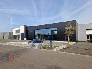 Newly built industrial building with a total surface of 2,265 m² consisting of 1,355 m² warehouse in combination with a showroom of 455 m² and on...