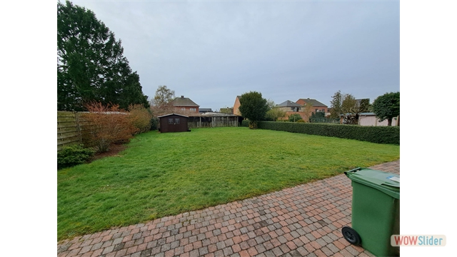 Een vrijstaande woning met tuin en inpandige garage - foto 5
