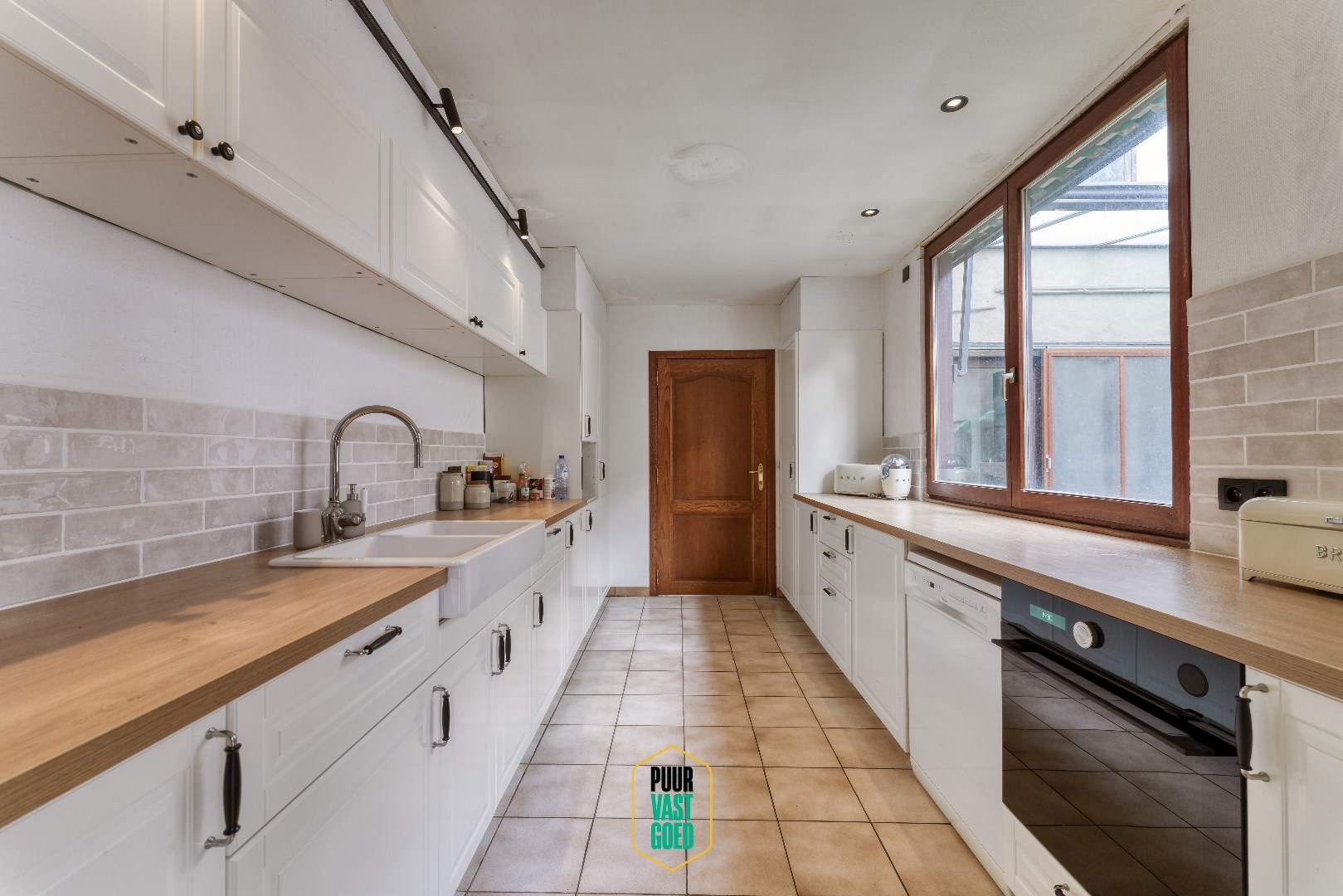 Handelsruimte met achteruitgang en 2 appartementen! - foto 4