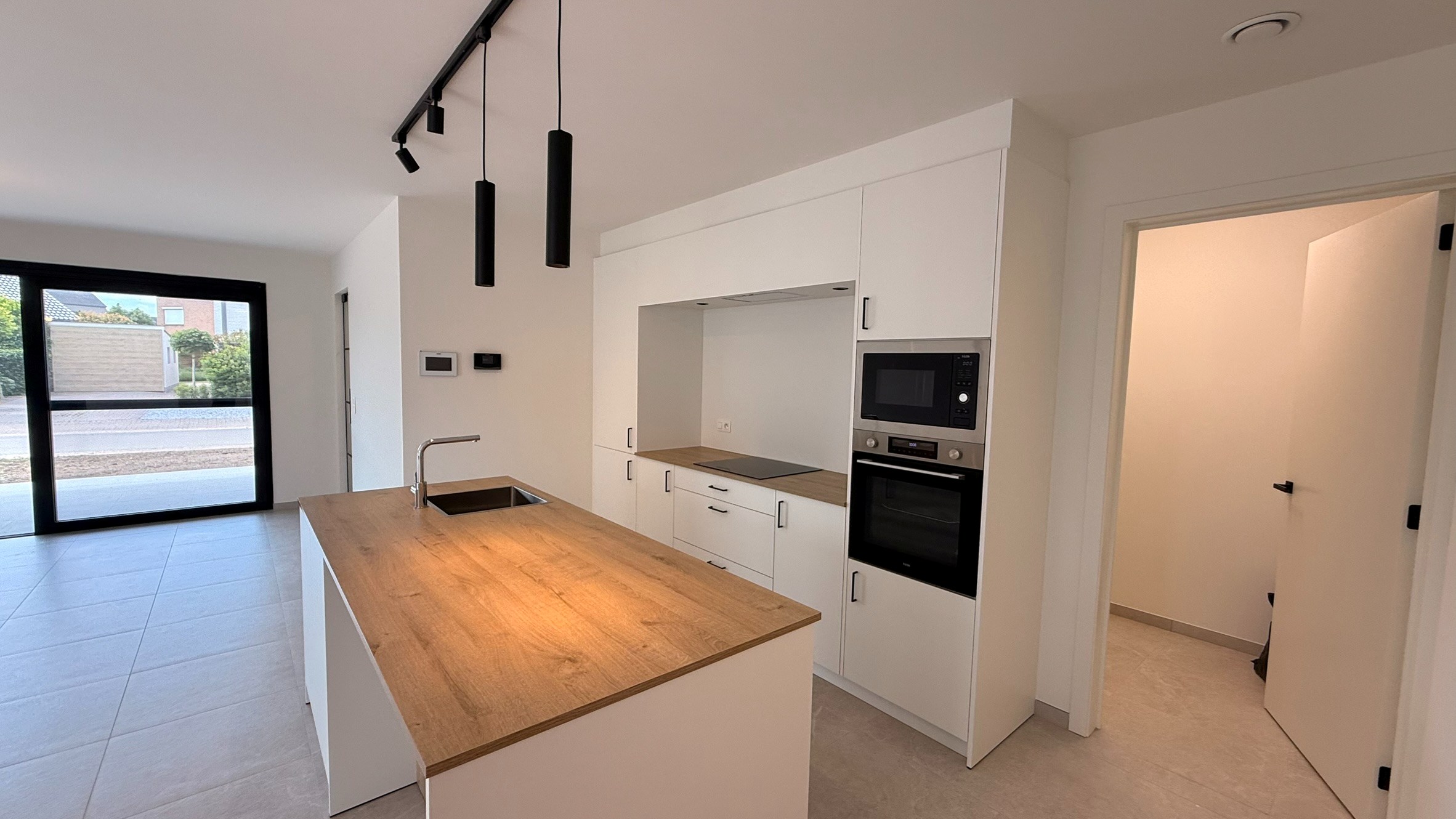 Gelijkvloers nieuwbouwappartement met tuin in Bree - foto 4