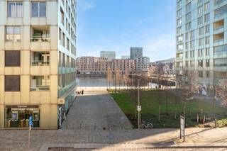 <p>This exceptional loft apartment is located in a characterful brutalist building in a prime location on Antwerp's Eilandje. The exposed concrete ceiling gives the interior a powerful, architectural look that blends perfectly with the clean lines and abundant natural light.</p>
<p><span>The apartment has been built with energy efficiency in mind and offers an extremely flexible floor plan: everything can be perfectly arranged as one open, loft-like space. The fully fitted kitchen connects seamlessly to the dining room and living room, which together enjoy a beautiful view of the water — a daily feeling of peace and space.</span></p>