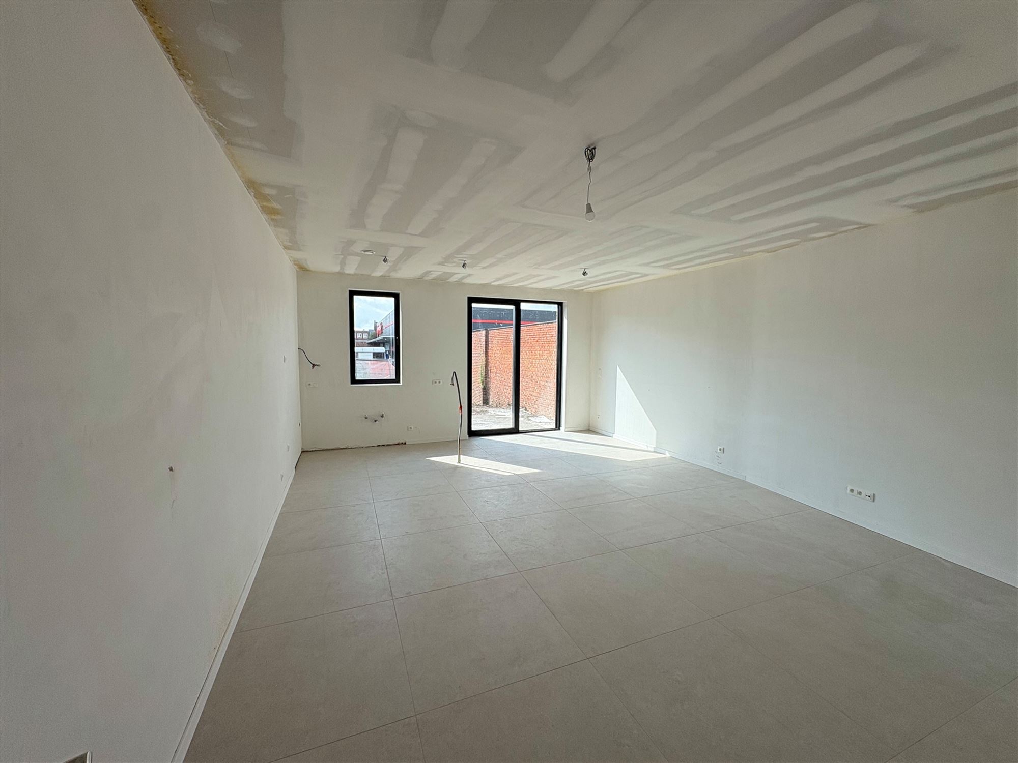 Nieuwbouwappartement met 1 slaapkamer en grote tuin. - foto 5