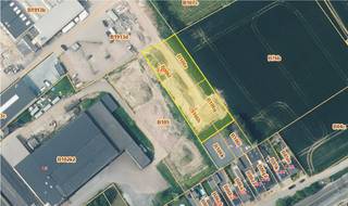 Land for sale in Ninove. This ready‑to‑build industrial site of 2,252 m², sold with a permit, is offered without any construction obligation...