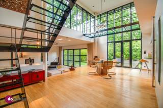 <p><span>An architectural gem in the Lievekensbossen in Schiplaken</span></p><p><span> </span></p><p><span>Located in the green and sought-after surroundings of the Lievekensbossen in Schiplaken, centrally situated between Leuven, Mechelen, Antwerp, and Brussels, stands this forward-thinking architect-designed home from 1994. A unique villa where tranquility, modern design, and an exceptional sense of light come together.</span></p><p><span> </span></p><p><span>Designed by architect Frederic Leers, this home seamlessly blends aesthetics and functionality. High-quality materials such as granite in the kitchen, marmoleum in the entryway, and warm beech in the living area give the entire home a timeless and refined look. Large windows allow natural daylight to flood in, creating a dynamic, warm atmosphere throughout the entire home.</span></p><p><span> </span></p><p><span>On the ground floor, you enter a spacious living area with a sleek and modern character. Thanks to the underfloor heating, the generous windows, and the automatic blinds, you can enjoy maximum comfort and flexibility in the layout here. The open kitchen forms a harmonious whole with the living area but can easily be closed off if desired via a stylish, movable cabinet.</span></p><p><span> </span></p><p><span>The first floor features three full-sized bedrooms. The Master Bedroom, with an adjoining bathroom equipped with both a bathtub and shower as well as elegant stainless steel designer sinks, is a true showstopper.</span></p><p><span> </span></p><p><span>The top floor, designed as an open loft with built-in cabinets, offers a perfect balance between work and relaxation. Here you have a versatile space, ideal as an office or cozy TV corner, which opens onto the spacious terrace via an aesthetic light bridge.</span></p><p><span> </span></p><p><span>The home also features a practical laundry room and a spacious indoor garage with room for two cars.</span></p><p><span> </span></p><p><span>Finally, the home has an EPC rating of C, which further highlights the harmonious combination of energy efficiency, modern comfort, and architectural quality.</span></p><p><span> </span></p><p><span>Let yourself be surprised by this unique living experience and schedule your visit today.</span></p><p><span> </span></p><p><span>015 20 36 00 - <span>info@domoxim.be</span></span></p><p><span> </span></p><p><span>domoXim. Where dreams come home!</span></p><p><span> </span></p><p><span>Do you want to know the value of your </span><span>own</span><span> home? We’d be happy to advise you.</span></p>