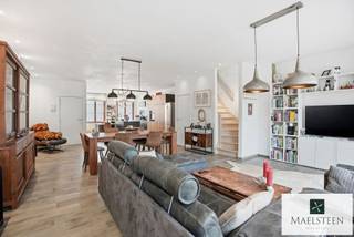 This very spacious, move-in ready home, located in the centre of Bruges, is quietly tucked away near the Vesten. Here, you enjoy surprising tranquillity in the heart of the city while benefiting from an excellent connection to the ring road (mobiscore 9.1/10). The layout of the house still offers numerous possibilities.<br /><br />Layout: Entrance hall with cloakroom and guest toilet. Large living area with an impressively high ceiling and plenty of natural light. This warm space includes the lounge, dining area, and a highly functional open-plan kitchen with a central island. Adjoining the living area is a pleasant city terrace enjoying afternoon sun.<br />On the first floor, a spacious landing/night hall leads to a first bedroom with its own shower room and a second bedroom (master suite) with dressing room and adjoining luxurious bathroom. An additional very sunny rooftop terrace has been created on the roof.<br /><br />The basement consists of several rooms, including two storage rooms, a very large office that can also serve as a second living room, a technical room, etc.<br />A secure bicycle storage room is included in the price. A parking space in front of the door can be purchased separately.<br /><br />Additional assets: EPC rating A (81 kWh), 5 solar panels and a 10,000-litre rainwater tank. The largest bedroom can easily be divided into two separate spaces.<br /><br />Please feel free to contact us with any questions or to arrange your personal appointment (7/7): 0478 93 72 00 or maxime@maelsteen.be