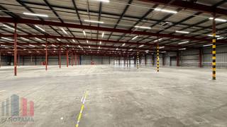 Industrial building with warehouse space ranging from 1,316 to 11,730 m² (offices optional).<br />Located in Satenrozen, easily accessible via the E19, 20 minutes from Antwerp and 30 minutes from Brussels.<br /><br />The warehouse space has a clear height of 4 to 8 meters and a floor load capacity of up to 5 tons/m², making it ideal for storage and heavy equipment. For smooth logistics, sectional doors and loading/unloading docks are available. The office spaces are finished with tiles and carpet for added comfort.<br /><br />The property offers ample parking, including charging stations for electric vehicles, as well as catering and cafeteria facilities for staff.<br /><br />Contact <strong>PANORAMA B2B</strong> for more information, plans, or a non-binding site visit at <strong>0477 07 30 30.</strong>
