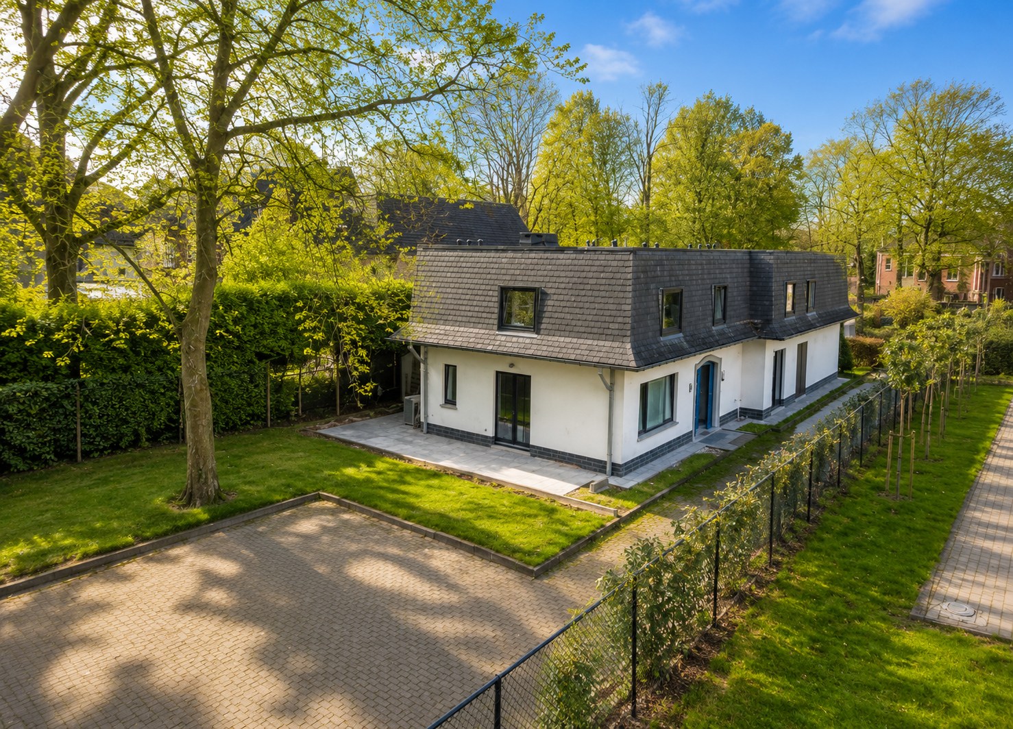 Uitzonderlijk opbrengsteigendom met 5 entiteiten, ruime zuidgerichte tuin en sterke investeringsopportuniteit in rustige groene woonomgeving te Sint-Niklaas! - foto 2
