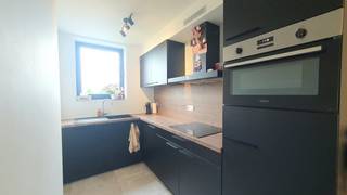 This energy-efficient and recent apartment in Kuringen is offered for rent and is the perfect home for those looking for modern comfort. Renting out this property offers a unique opportunity to enjoy a peaceful environment with close proximity to a bustling city. <br /><br />In addition, the building offers extra comfort with a communal laundry area equipped with washing machines and dryers. On floor -1, you have a private car park, a basement shed and a communal bicycle shed.<br /><br />The location in Kuringen is an absolute asset. All facilities such as schools, shops and public transport are within walking distance. In addition, there is a smooth connection to the motorway, which is ideal for commuters. <br /><br />The layout of the apartment is as follows:<br /><br />Ground floor: <br /><br />- Entrance hall<br />- Bright living space<br />- Fully equipped kitchen<br />- 2 bedrooms<br />- Bathroom with modern shower <br />- Separate toilet <br />- Practical storage<br />- Pleasant terrace<br /><br />Floor -1:<br /><br />- Basement storage<br />- Parking space<br />- Community bike shed<br /><br />The quickest way to visit this property? Request your visit via the red button on our website (www.dewaele.com).<br /><br />No appointments can be made by phone. For other questions, you can contact us by phone at 011 30 50 50.<br /><br />See you soon<br />
