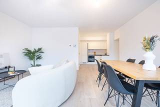 LAEKEN - located inside the lot you will find this splendid 109m² 2 bedroom duplex with a beautiful south west terrace. Built FUTUR PROOF with attention to today's energy standards. On the first level it has the large living room with kitchen (super equipped) and WC. Upstairs there are two large bedrooms (13m² &amp; 14m²), a large utility room, a bathroom and a second separate WC. Flat available with ten-year warranty. Estimated charges +/- 75 €/month. PEB A-. RC estimate € 1,600. Sold with registration fees and 21% vat. Cellar (€ 3,000). Optional parking (€ 25,000). Visit now in exclusivity with Trevi Neuf.