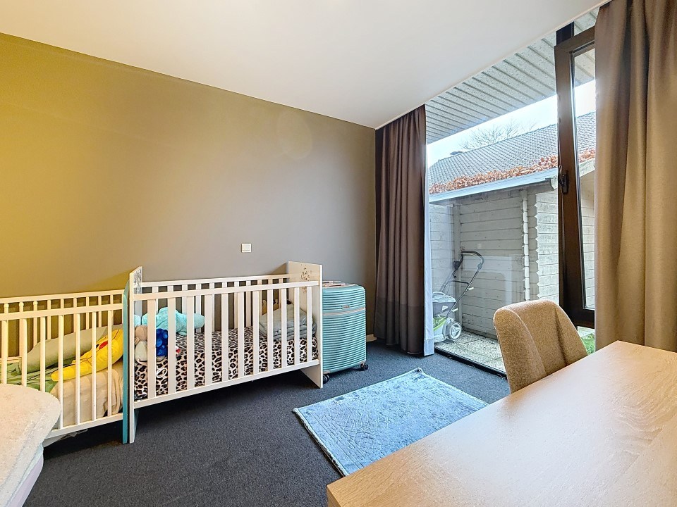 Centraal gelegen gelijkvloers appartement met tuin en garage - foto 5
