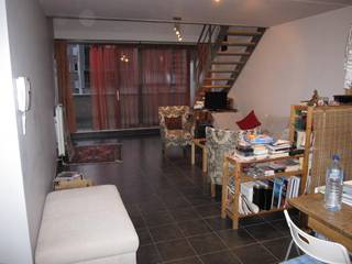 Het duplexappartement (n° 13) gelegen op de eerste en tweede verdieping en er omvattende: inkom, eetruimte, zitruimte, terras, open keuken,...