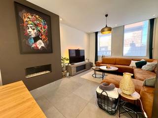 IndelingGLV: inkomhal (3,28m²) - leefruimte met gascasette en open keuken bestaande uit een keukeneiland, vaatwas, frigo, gasbekken, oven en...