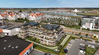 Dit appartement maakt deel uit van het nieuwbouwproject 'Residentie One Harbour'.<br /><br />Het appartement bevindt zich op de eerste verdieping en werd ingedeeld als volgt:<br />Inkom, toilet, berging, keuken, leefruimte met aanpalend terras, 2 slaapkamers met toegang tot terras en een badkamer.<br />De terrassen zijn zuidwestelijk/noordoostelijk georiënteerd. <br /><br />Verplicht aan te kopen garagebox of staanplaats niet in de prijs inbegrepen. <br /><br />Appartement: 88 m²<br />Terrassen: 21 m²