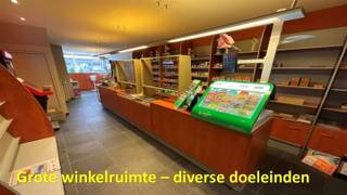 HANDELSPAND - GELEGEN LANGS EEN VLOTTE VERBINDINGSWEG - Handelsgelijkvloers bestaande uit een grote winkelruimte, achtergelegen werkruimte, keuken...