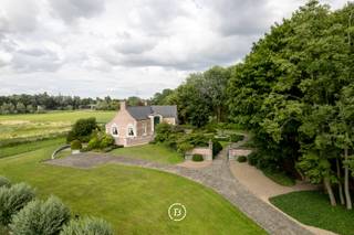 Set in a quiet, green location near the centre of Izegem, this characterful villa was designed by Marcel Raymakers of Queen of the South...
