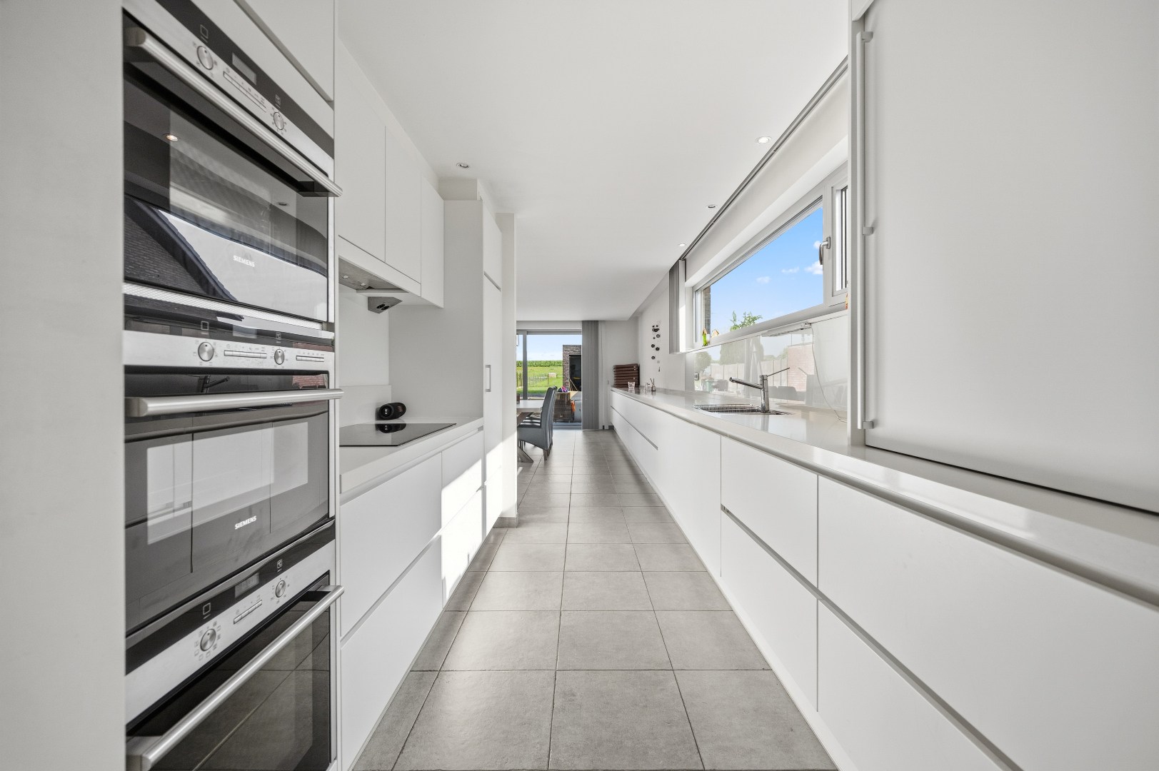 Mooie instapklare woning met tuin, terras, garage en 4 slpks - foto 4