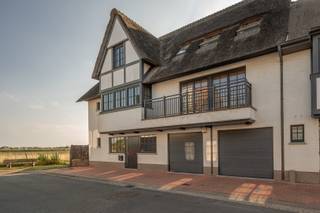 Fantastic house for sale in Knokke with breathtaking views and sunshine all day long<br />This recent (2017) and perfectly maintained property with a living area of approx. 320 m² combines space, light, and phenomenal views. Thanks to its southwest orientation, you can enjoy the sun all day and a unique panorama.<br />Layout:<br />Ground floor: entrance hall with guest toilet, storage room, and integrated garage. A bedroom (currently used as an office) with a separate shower room (connections provided, not yet installed).<br />First floor: spacious living room with gas fireplace and large windows opening onto a sunny terrace with spectacular views. Adjoining dining area and semi-open, fully equipped kitchen. Additional storage room.<br />Second floor: master bedroom with built-in wardrobes and ensuite shower room. Third bedroom with fitted wardrobes and private bathroom. Fourth room, currently used as a dressing room, also with shower room.<br />Additional features: alarm system, energy-efficient EPC (78), high-quality finishes, and move-in ready.<br />A unique opportunity to live in full comfort in a prime location in Knokke, with views that will never cease to impress.<br /><br />For more information or a visit, please contact Tine Vandenberghe:<br />T: +32 497 53 45 29 or info@Tine.immo<br />You can find the video below: virtual tour.