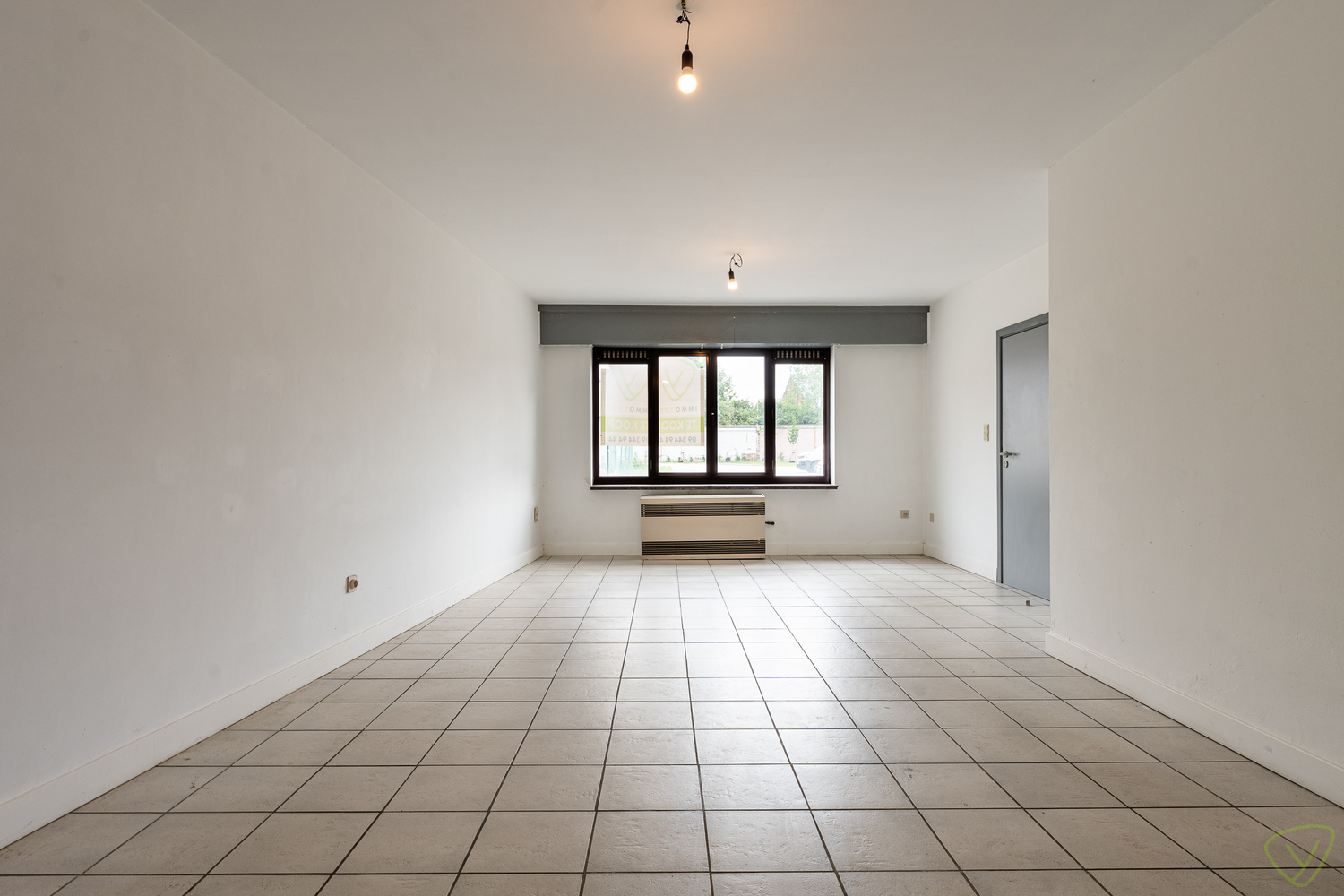 Ruim gelijkvloersappartement met private garage in de Kaaistraat! - foto 4
