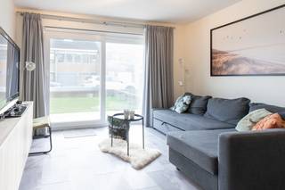Fantastisch gelijkvloers 2-slaapkamerappartement te koop gelegen langs de rustige Duinhelmstraat te Oostende - Mariakerke. Op slechts 200m van de zee en het strand! In 2021 onderging het appartement een totaalrenovatie waardoor alles perfect in orde is.Indeling:- inkomhal- leefruimte met toegang tot het terras vooraan- open geïnstalleerde keuken voorzien van alle comfort (spoeltafel, vaatwas, ruime frigo, afzonderlijke diepvries, combioven en inductie kookplaat)- badkamer uitgerust met een inloopregendouche, badkamermeubel en opbergkast- slaapkamer 1 (12m²) met grote ingemaakte kleerkast - via slaapkamer 1 heeft u toegang tot het magnifieke terras (18m²) met tuintje (30m²), voorzien van een tuinhuis voor extra opbergruimte- slaapkamer 2 (6m²) met kast- afzonderlijk toilet Pluspunten: - instapklaar, voorzien van zeer veel opbergruimte (ingemaakte kasten)- positieve elektrische keuring- aangenaam terras met tuintje - EPC label C- rustige ligging- onderging in 2021 een totaalrenovatie - tuinhuis Bent u op zoek naar een rustig gelegen instapklaar appartement met tuintje op slechts enkele wandelpassen van zee en strand? Bel ons voor een bezichtiging ter plaatse!