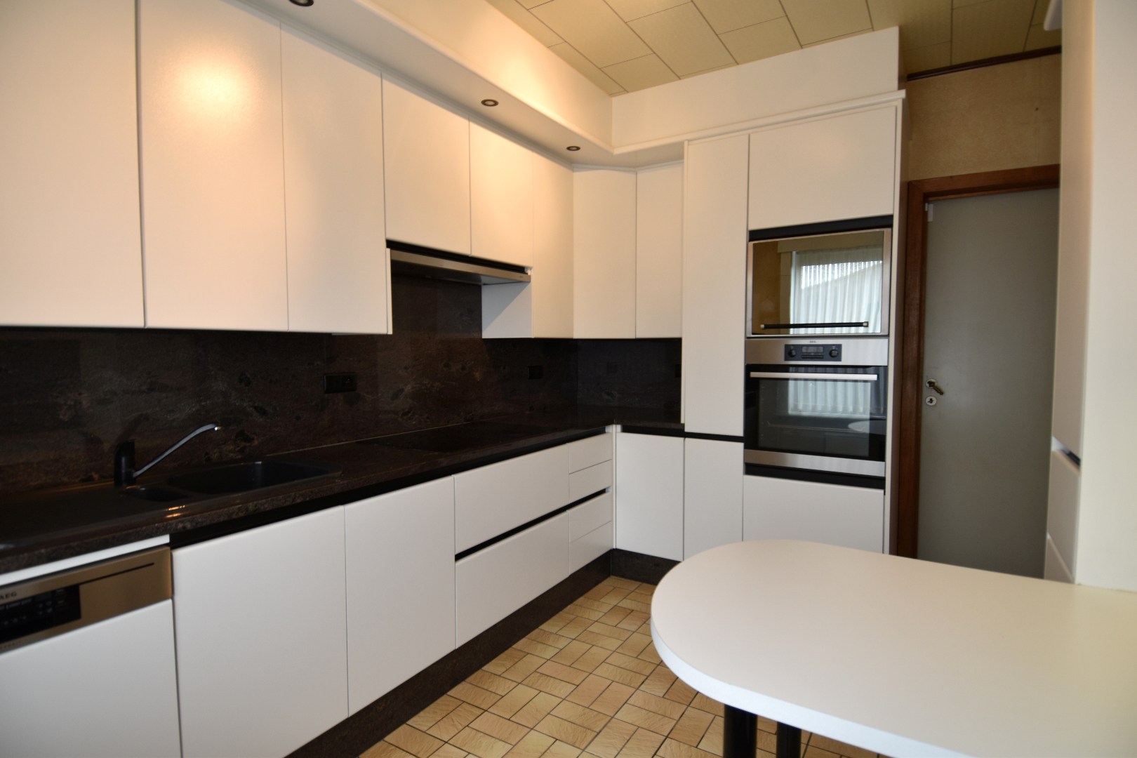 Halfopen bebouwing met 2 slaapkamers, garage en tuin in landelijke omgeving te koop in Gullegem - foto 4