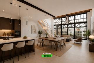 Deze prachtige loft bevindt zich in Loods 23, een hedendaags project uit 2017 in de Dublinstraat te Gent. De centrale ligging zorgt voor een vlotte verbinding met het stadscentrum, terwijl winkels, voorzieningen en tal van gezellige horecazaken in de levendige Muidewijk zich op korte afstand bevinden.<br /><br />De loft is gelegen op de eerste verdieping. Bij het binnenkomen valt meteen de overvloed aan natuurlijk licht op, die de open leefruimte volledig tot zijn recht laat komen. Deze ruimte leent zich perfect als combinatie van woonkamer, eetkamer en keuken. Aansluitend bevindt zich een ruim terras met praktische berging, zonder twijfel één van de absolute troeven van dit pand. De aansluitingen voor een keuken en kookeiland zijn reeds voorzien, waardoor u de inrichting nog volledig naar eigen smaak kan afwerken. Verder beschikt deze verdieping over een gastentoilet en een technische berging.<br /><br />Op de tweede verdieping bevindt zich een polyvalente ruimte, ideaal als bureau, dressing of hobbyruimte. Daarnaast zijn er twee ruime slaapkamers en een badkamer.<br /><br />In de kelderverdieping beschikt u over een extra berging en een privatieve staanplaats, verplicht aan te kopen aan € 45.000.<br /><br />De energiezuinigheid, het open karakter, de grote raampartijen en de vele indelingsmogelijkheden maken van deze loft een unieke woonkans op een toplocatie.<br /><br />Interesse? Contacteer Brent via brent@immofrancois.be voor meer informatie of om een bezoek in te plannen.<br /><br />