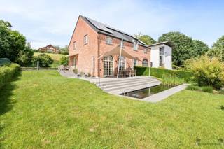 <p><span>Spacious 4 bedroom villa in Linden.</span></p><p><span>In a convenient location in a quiet cul-de-sac you will find this excellently maintained villa, in new condition, on a fully fenced plot of 748 sqm. With a living area of 322 m², this home offers a perfect combination of space, comfort and energy efficiency.</span></p><p><span>The home features a bright split-level living space with high ceilings and solid plank flooring, a fully equipped kitchen with recent quality appliances, a practical storage room and an indoor garage with custom cabinets. On the first floor you will enjoy underfloor heating.</span></p><p><span>Furthermore, there are 4 full bedrooms and a recently renovated bathroom with walk-in shower, bathtub, double sink and toilet. The living attic of 56 m², accessible via a fixed staircase, offers numerous possibilities as an extra bedroom, hobby room, playroom or home office.</span></p><p><span>Outside you will enjoy a fully landscaped garden with water feature, atmospheric lighting, multiple terraces, awning and sunscreen. A durable full-core gazebo and ample parking complete the property.</span></p><p><span>Thanks to solar panels, a home battery, charging station, condensing boiler, air conditioning and an alarm system, the home also scores highly in terms of energy efficiency.</span></p><p><span>Advantages</span></p><ul><li><span>322 m² of living space</span></li><li><span>4 full bedrooms</span></li><li><span>Attic of 56 m²</span></li><li><span>Recently renovated bathroom</span></li><li><span>Underfloor heating on the first floor</span></li><li><span>Solar panels, home battery and charging station</span></li><li><span>Air conditioning and alarm system</span></li><li><span>Indoor garage and several parking spaces</span></li><li><span>Quiet location in a cul-de-sac</span></li><li><span>Only 7 km from Leuven</span></li></ul><p><span>A move-in ready family home with exceptional space in a prime location in Linden.</span></p>