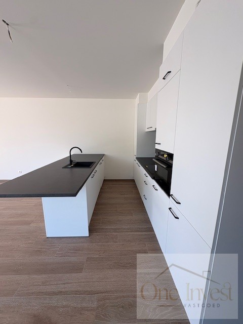 Te huur: stijlvol nieuwbouwappartement (gelijkvloers) met 2 slaapkamers in hartje Eksel - foto 5