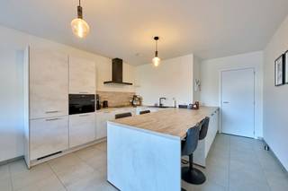 Energiezuinig gelijkvloers appartement met terras en tuin, zonnepanelen, 1 slaapkamer en ondergrondse parking op een rustige locatie in het...