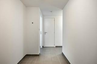 This ready-to-move-in apartment has a very convenient location, between the large and small ring roads of Hasselt. You are within walking distance of the city center and Quartier Bleu. You have a lot of shops and other facilities nearby, such as schools and public transport. The apartment is also close to roads, and thus provides good accessibility to the highway.<br /><br />The apartment is located on the first floor of the building. Through the entrance hall, you have access to the various rooms in the apartment. The living area with fully equipped open kitchen provides access to the terrace at the front of the building. The apartment also has a bathroom (equipped with a walk-in shower), a separate toilet with a hand washer and a bedroom.<br /><br />This apartment also has a private parking space. Ideal, because that way you don't have to find a parking space in the center of Hasselt. A communal bicycle shed was also provided.<br /><br />This apartment is perfect for private living but is also an interesting investment. Are you curious about this? Be sure to contact us!<br /><br />Register of measures: no
